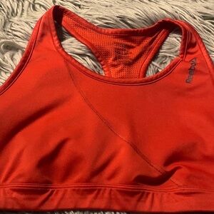 Reebok like new orange sports Bra size M